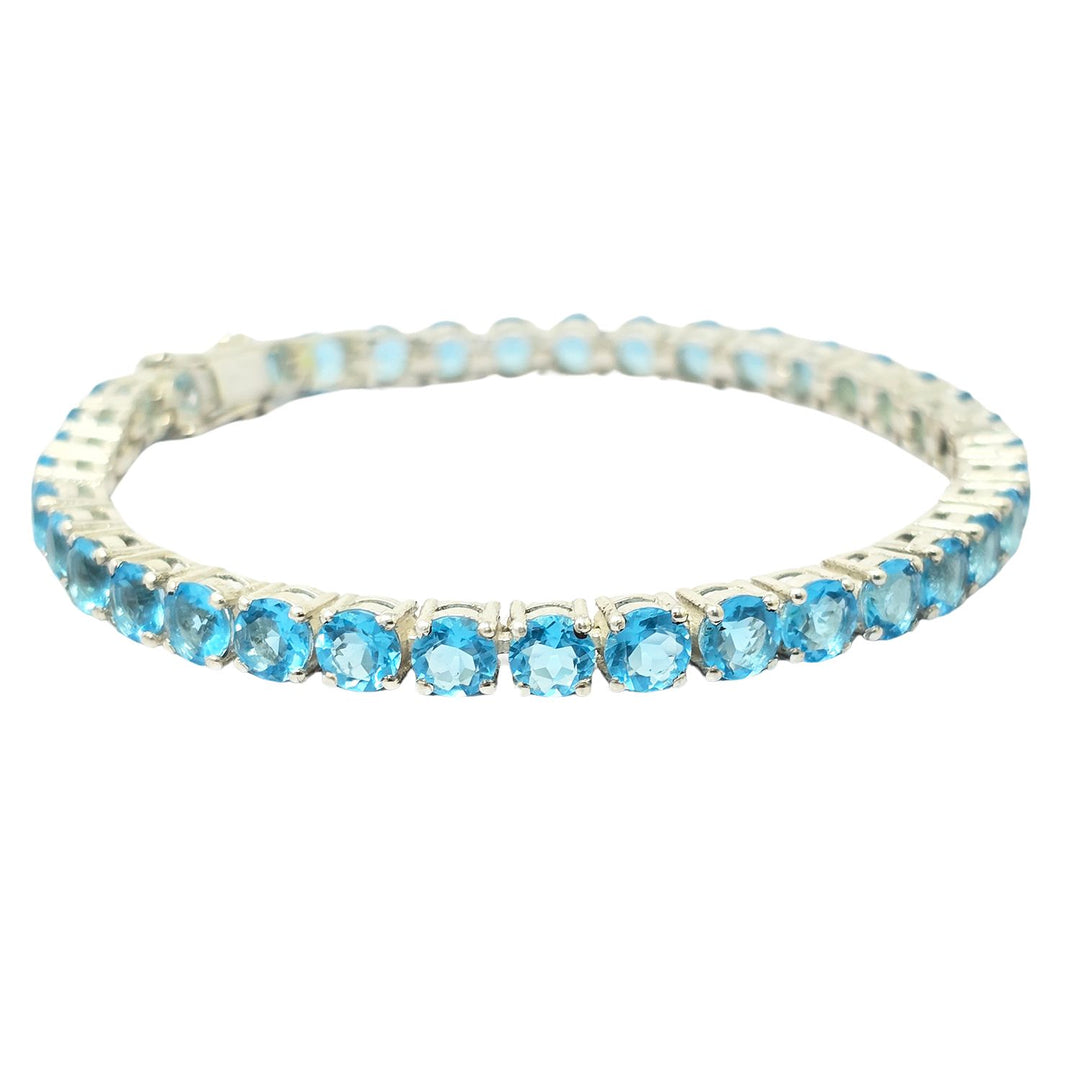 Elegant Sterling Silver Blue Topaz Tennis Bracelet