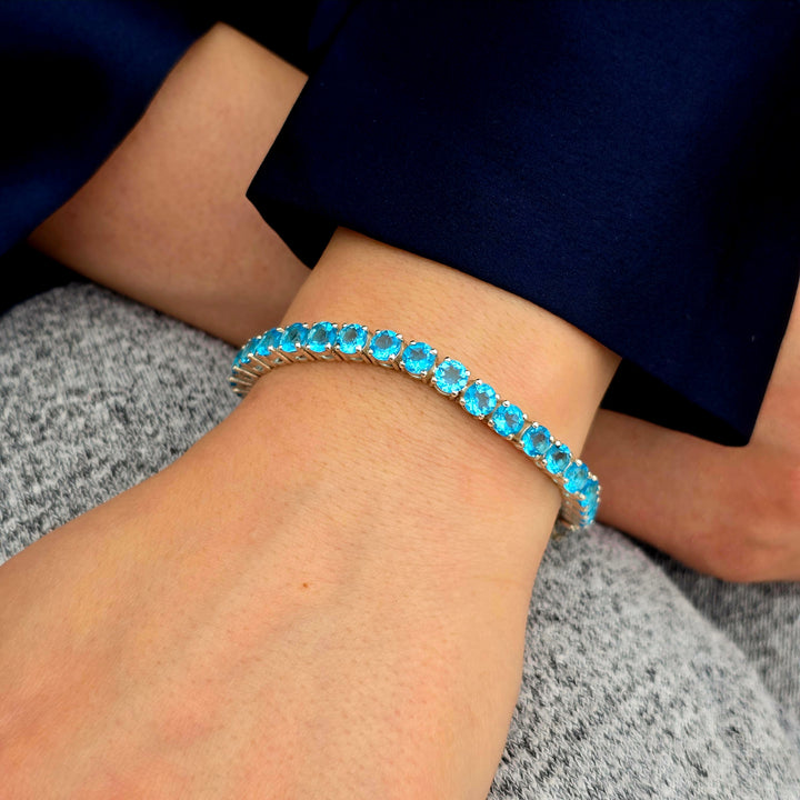 Elegant Sterling Silver Blue Topaz Tennis Bracelet